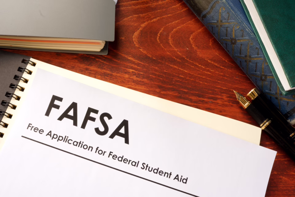 FAFSA form on a wooden desk with a pen and books, highlighting the importance of financial aid for Arizona seniors