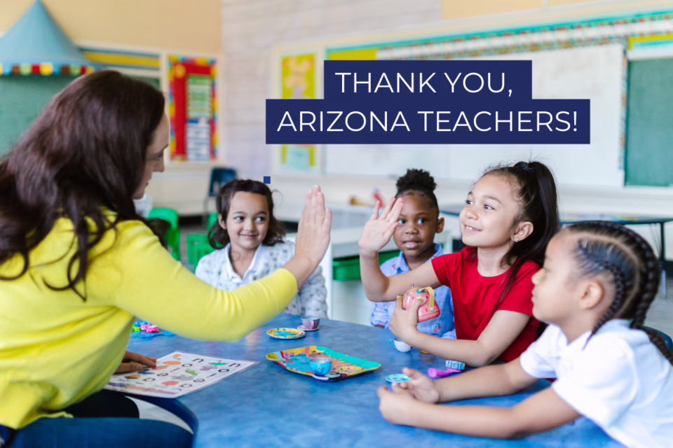 Teacher high-fives a student in a classroom. Text: "Thank you, Arizona teachers!