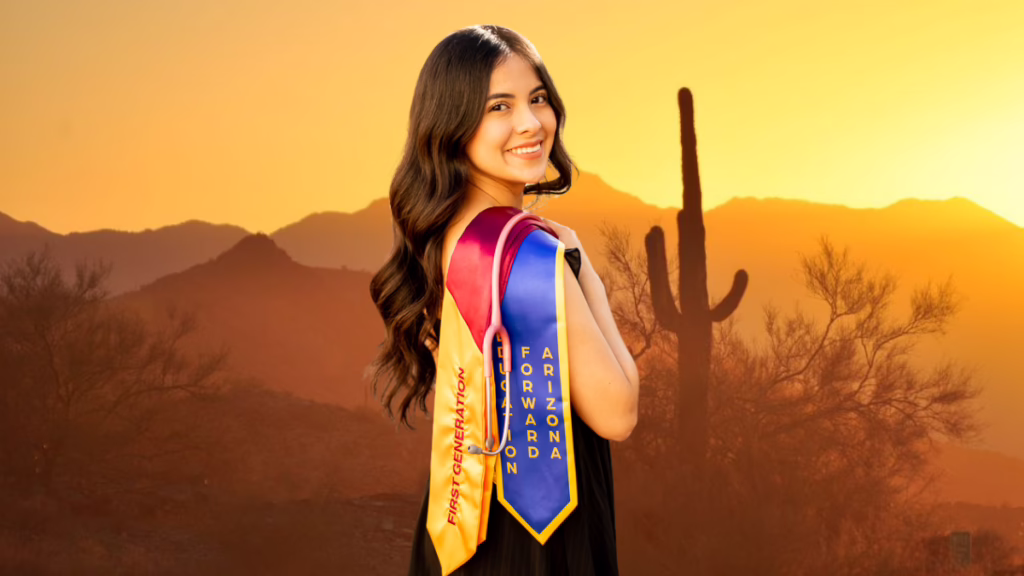 Smiling woman with graduation stoles reading "First Generation" and "Arizona Forward" against a desert sunset backdrop