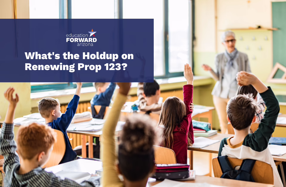 Children in a classroom raise hands with text overlay: "What's the Holdup on Renewing Prop 123?"